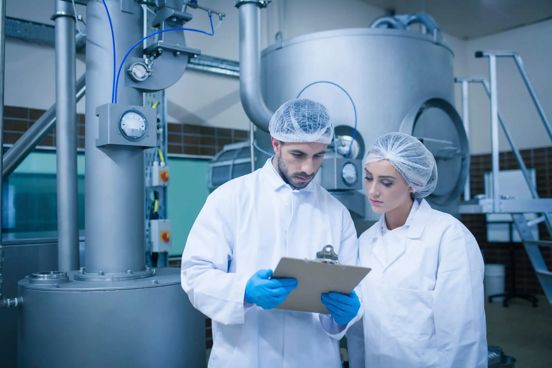 Two workers in a manufacturing facility