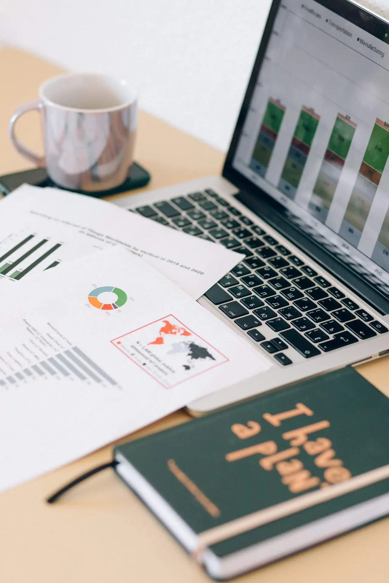 Laptop with charts and documents