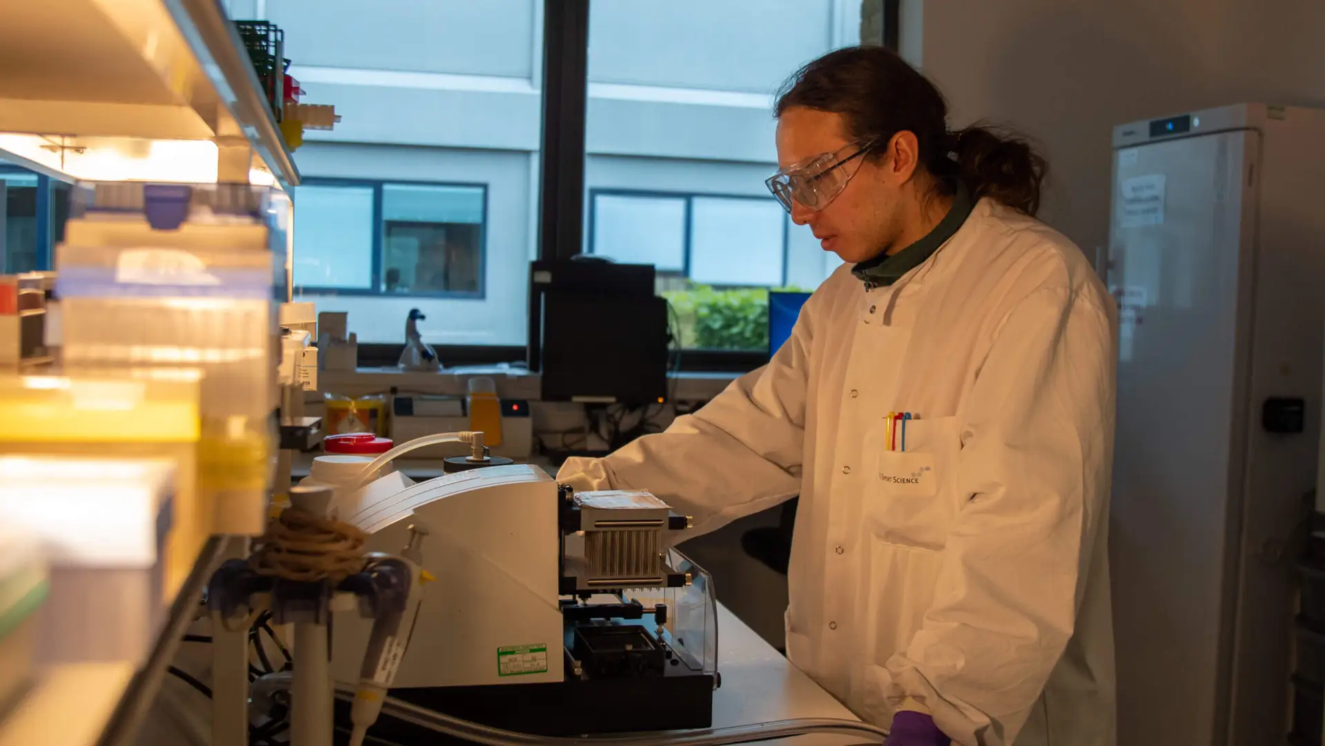 Scientist working in a laboratory. Resolian Flow Cytometry